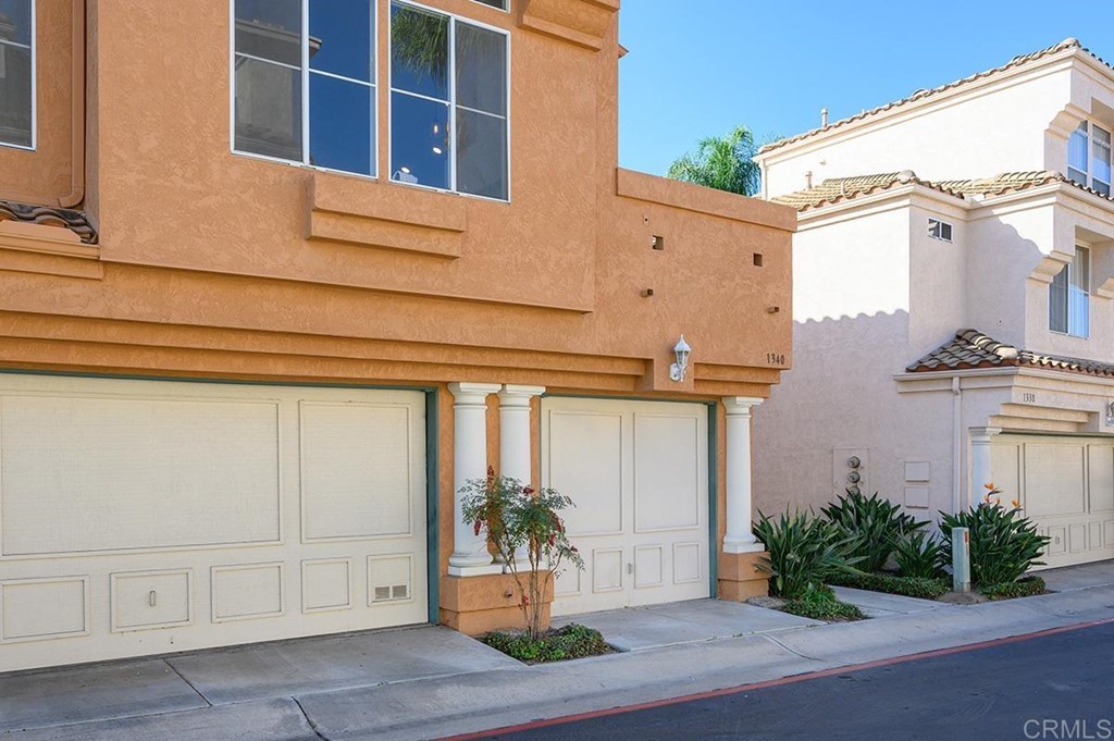 1340 Serena Circle, Unit 1 Chula Vista, CA 91910 - Photo 4 of 31 a front view of a house with a garden