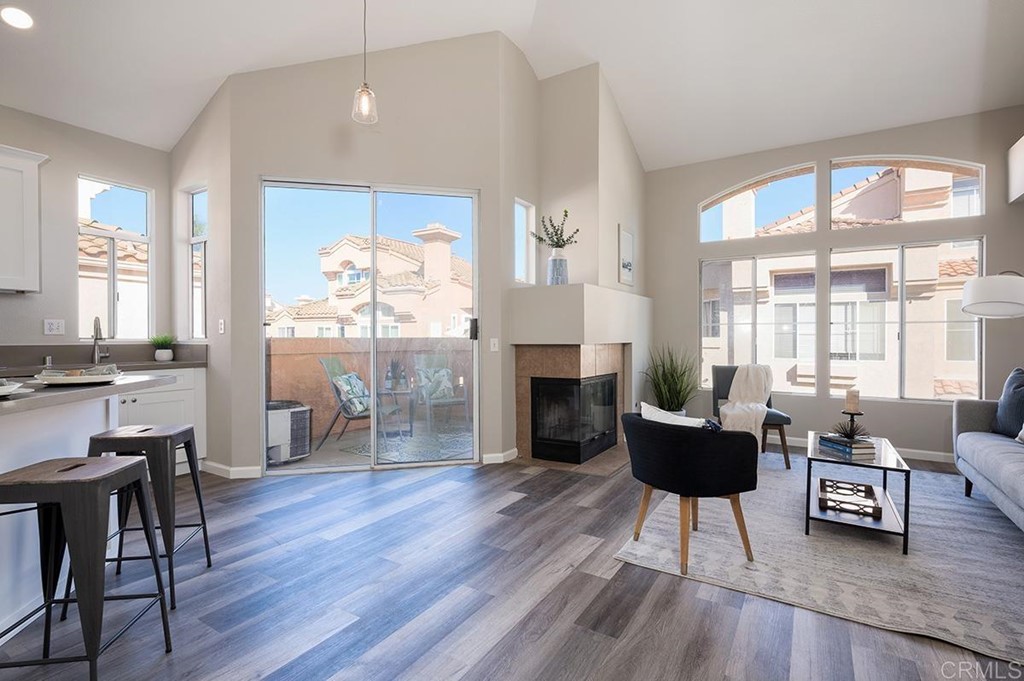 1340 Serena Circle, Unit 1 Chula Vista, CA 91910 - Photo 6 of 31 a living room with furniture a fireplace and a table