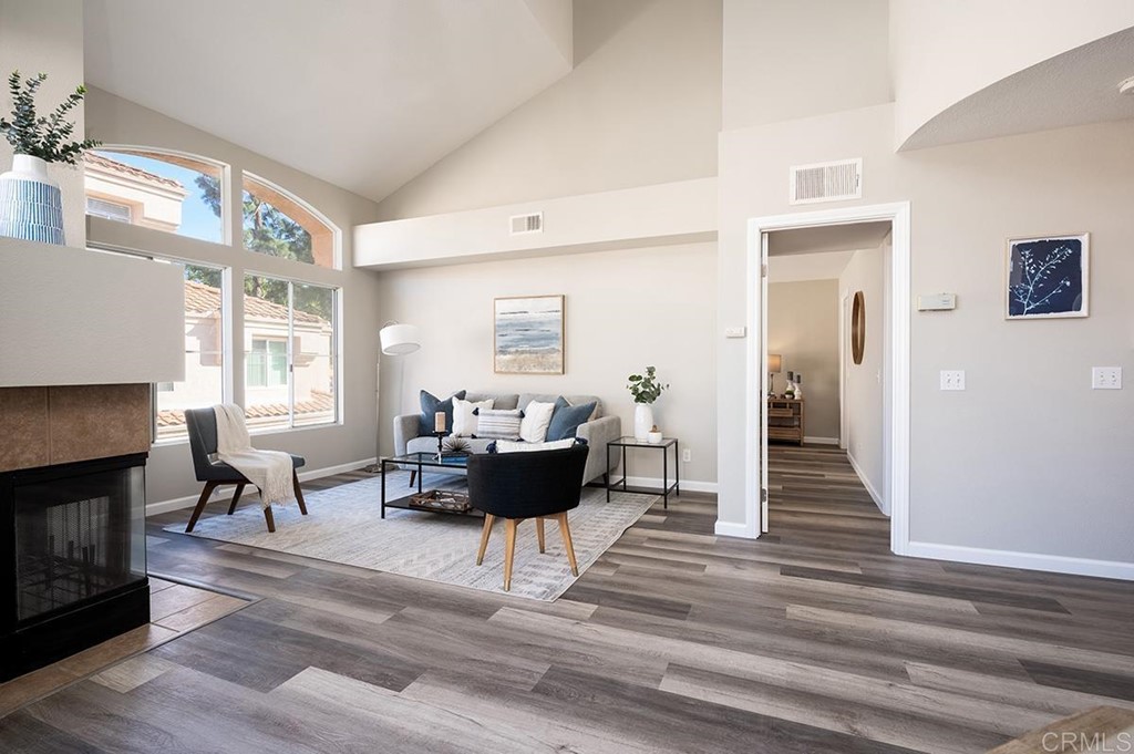 1340 Serena Circle, Unit 1 Chula Vista, CA 91910 - Photo 7 of 31 a living room with furniture dining table and a fireplace