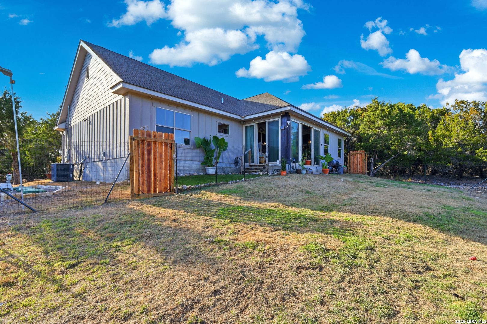 2295 Tanglewood Trail Spring Branch, TX 78070 - Photo 27 of 37 a view of a house with backyard and sitting area