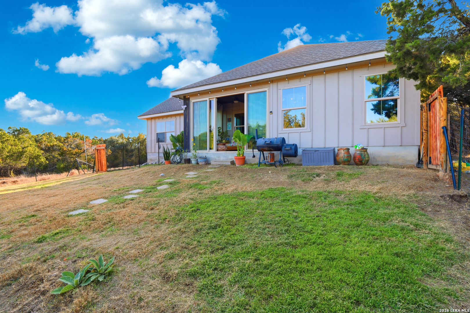 2295 Tanglewood Trail Spring Branch, TX 78070 - Photo 28 of 37 a view of a house with backyard porch and sitting area