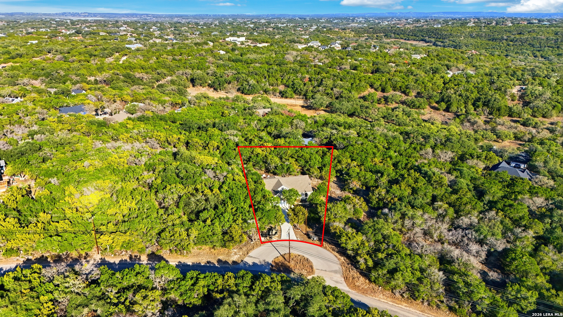 2295 Tanglewood Trail Spring Branch, TX 78070 - Photo 30 of 37 a view of a yard with plants
