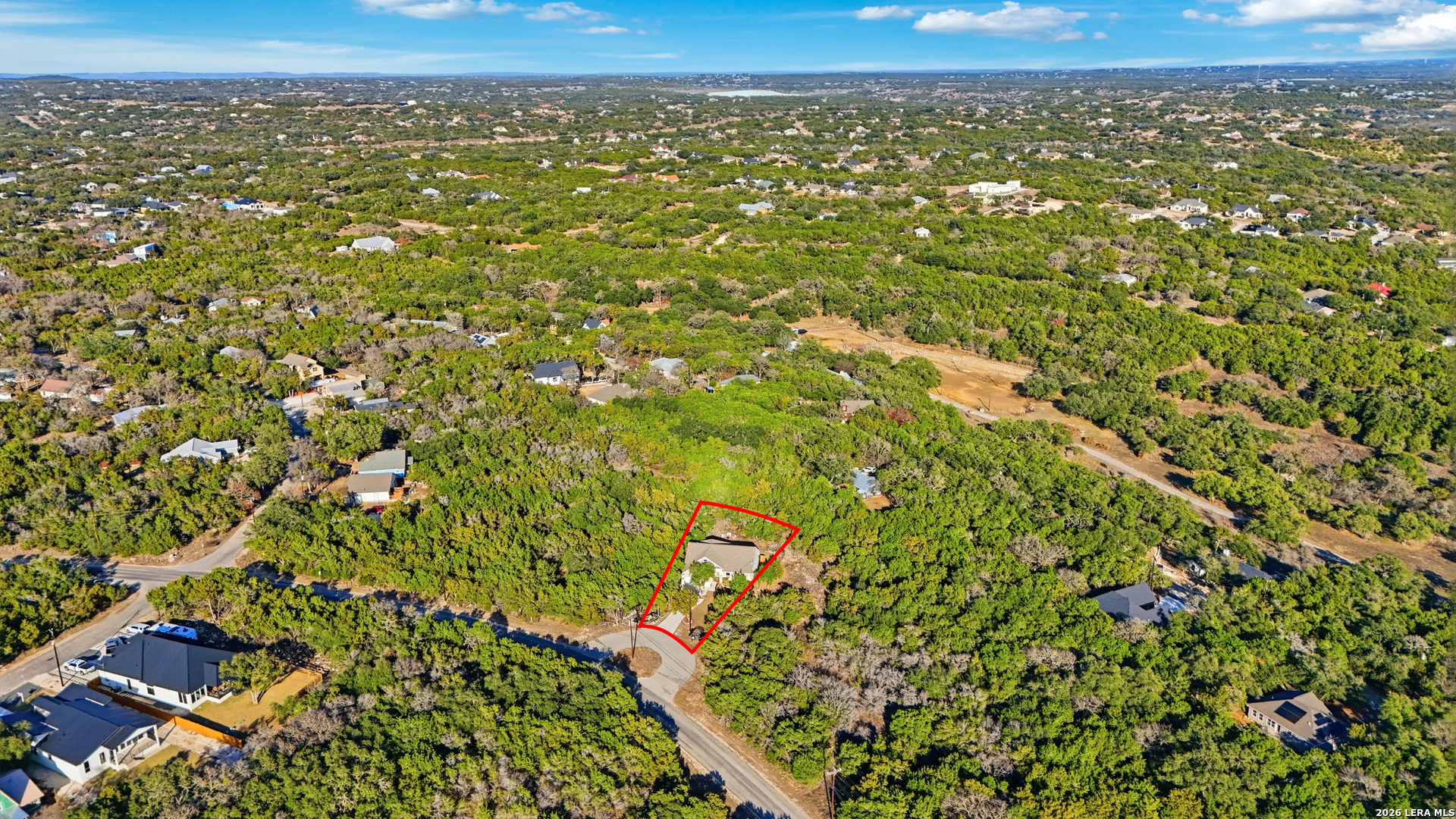 2295 Tanglewood Trail Spring Branch, TX 78070 - Photo 32 of 37 an aerial view of residential house with green space