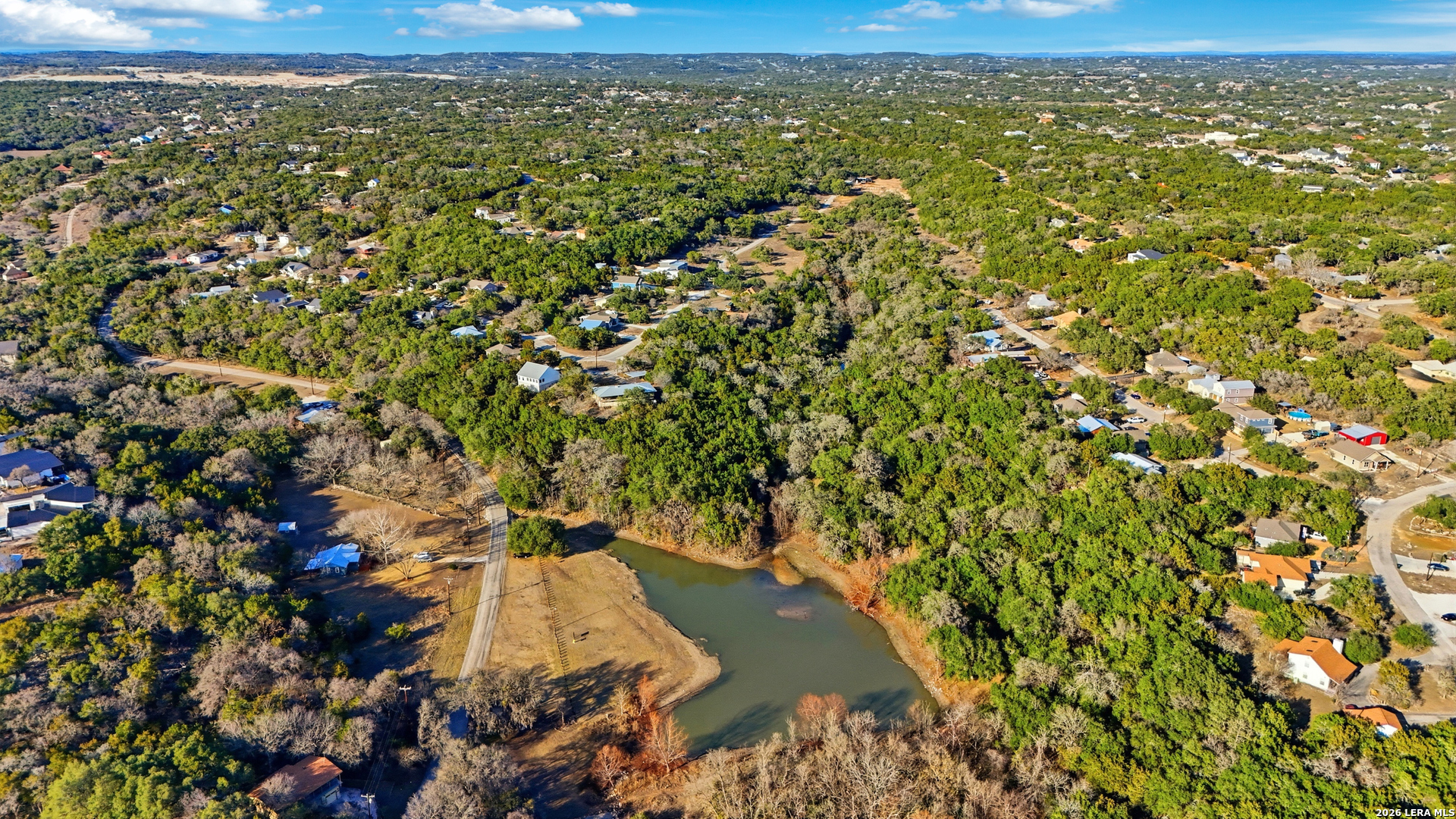 2295 Tanglewood Trail Spring Branch, TX 78070 - Photo 33 of 37 an aerial view of residential houses with outdoor space
