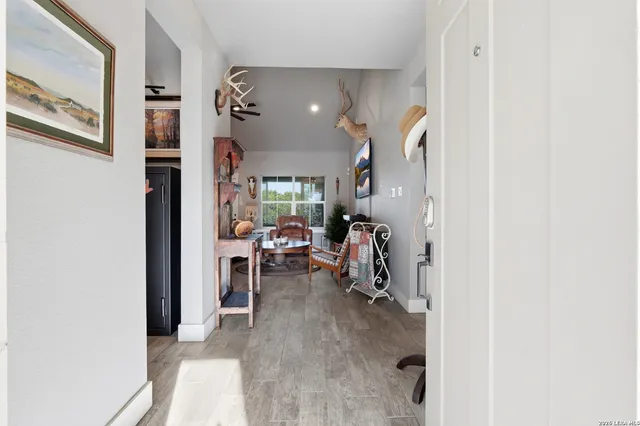 a view of a livingroom with furniture and a window