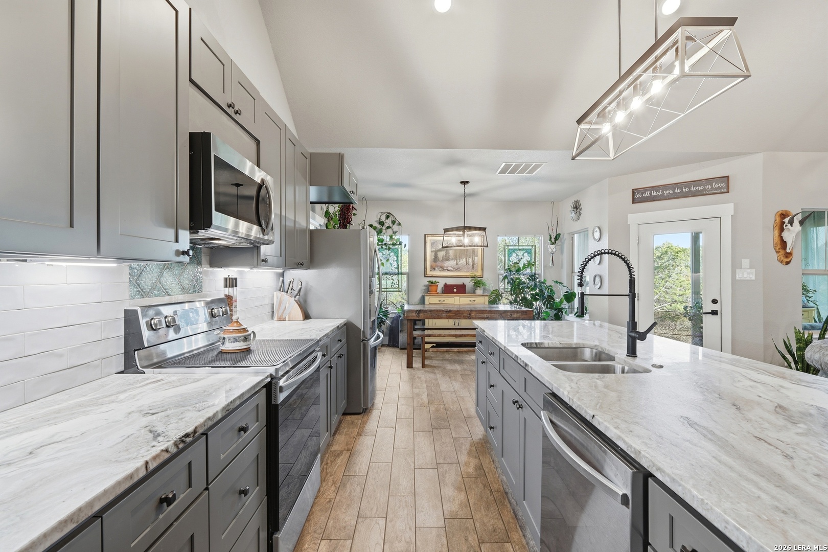 2295 Tanglewood Trail Spring Branch, TX 78070 - Photo 9 of 37 a kitchen with lots of counter top space and a sink