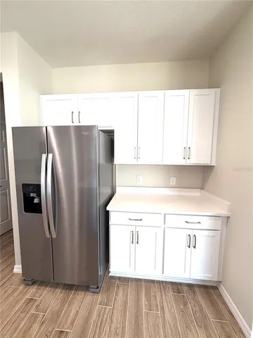 a large bathroom with double vanity and a large mirror