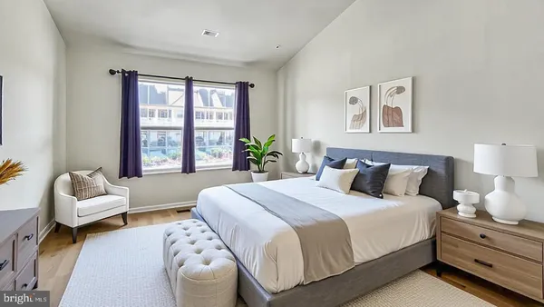 a bedroom with a bed and a couch