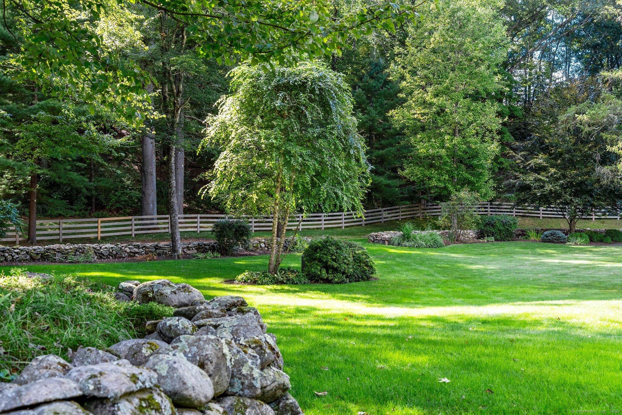 6 Pine Hill Road Burlington, CT 06013 - Photo 31 of 40 a view of a yard with a fence