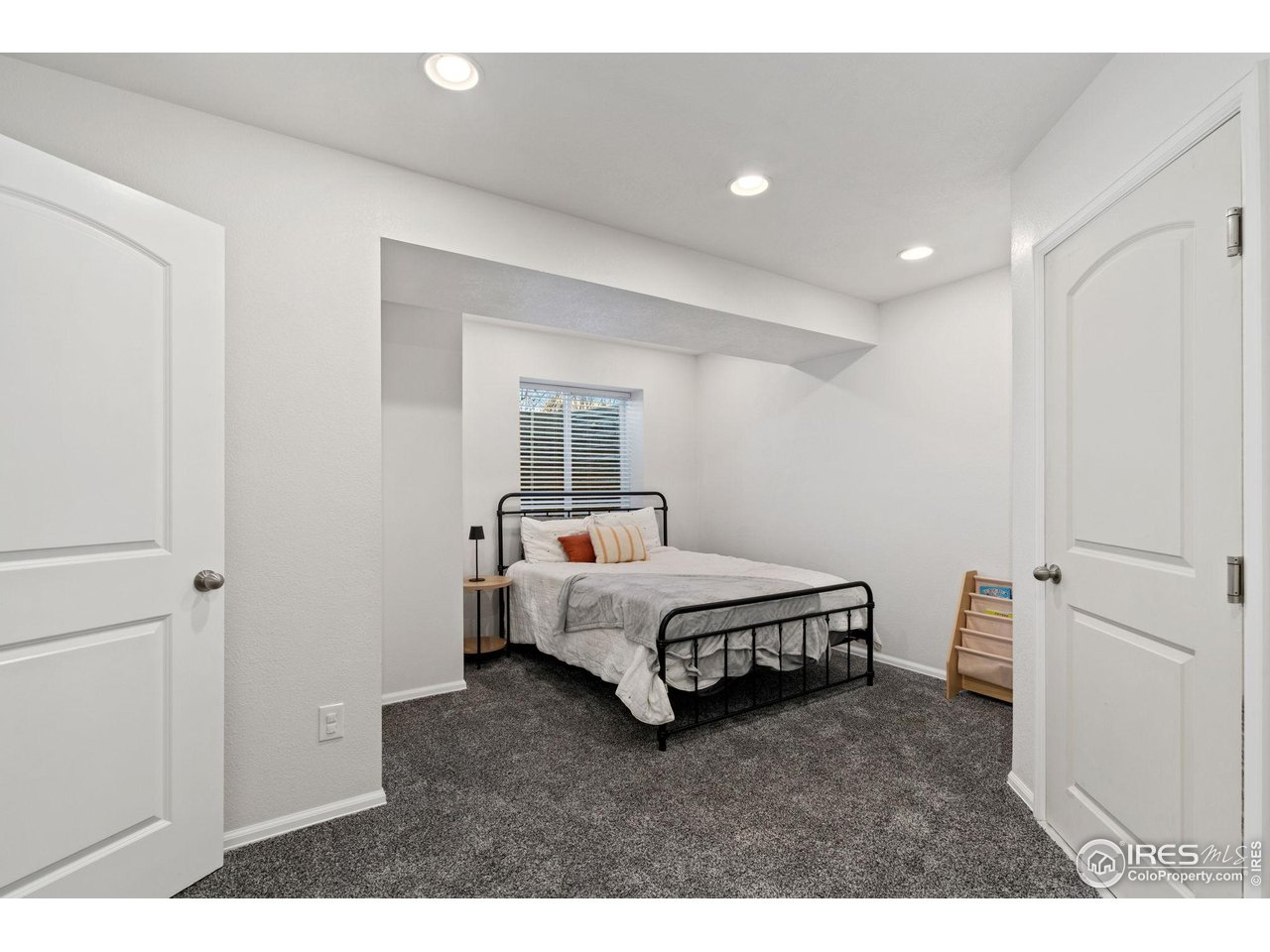 2004 Thundercloud Drive Windsor, CO 80550 - Photo 13 of 24 a spacious bedroom with a bed and a window