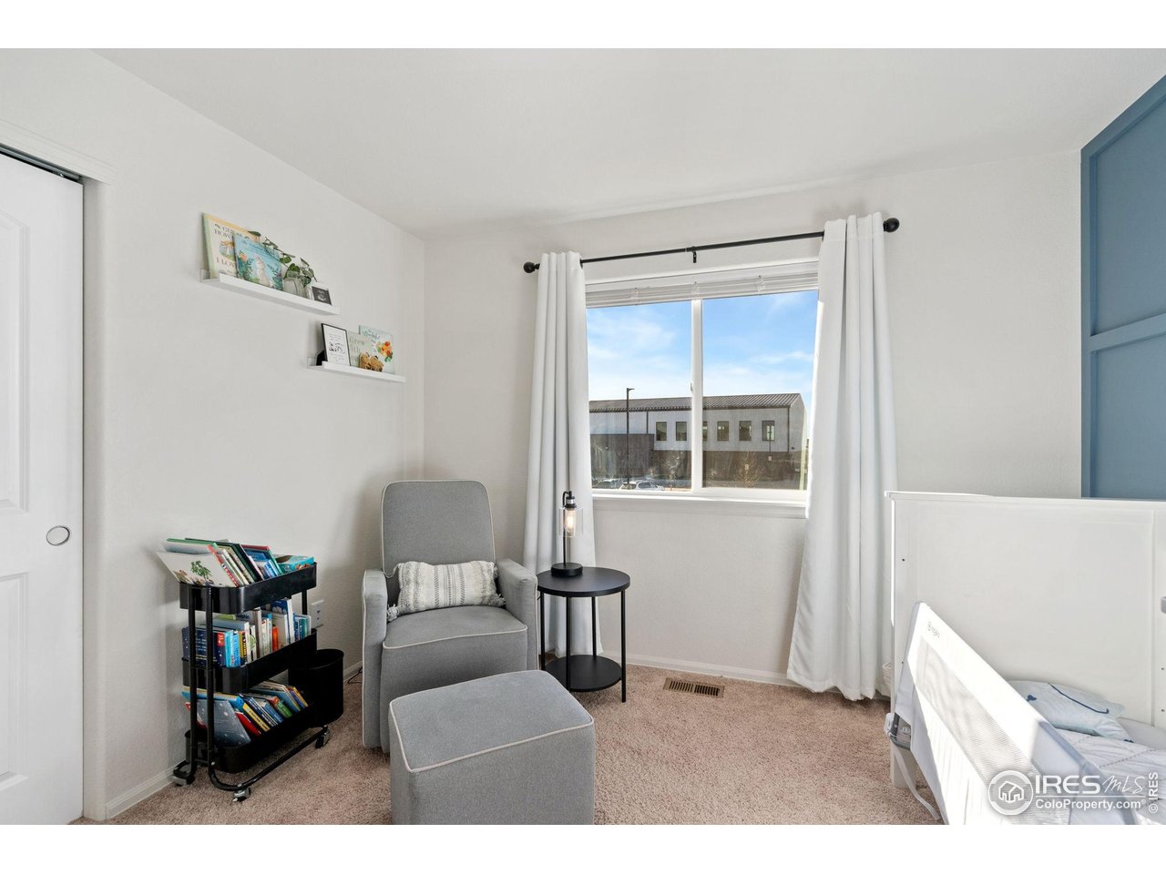 2004 Thundercloud Drive Windsor, CO 80550 - Photo 10 of 24 a living room with furniture and a window