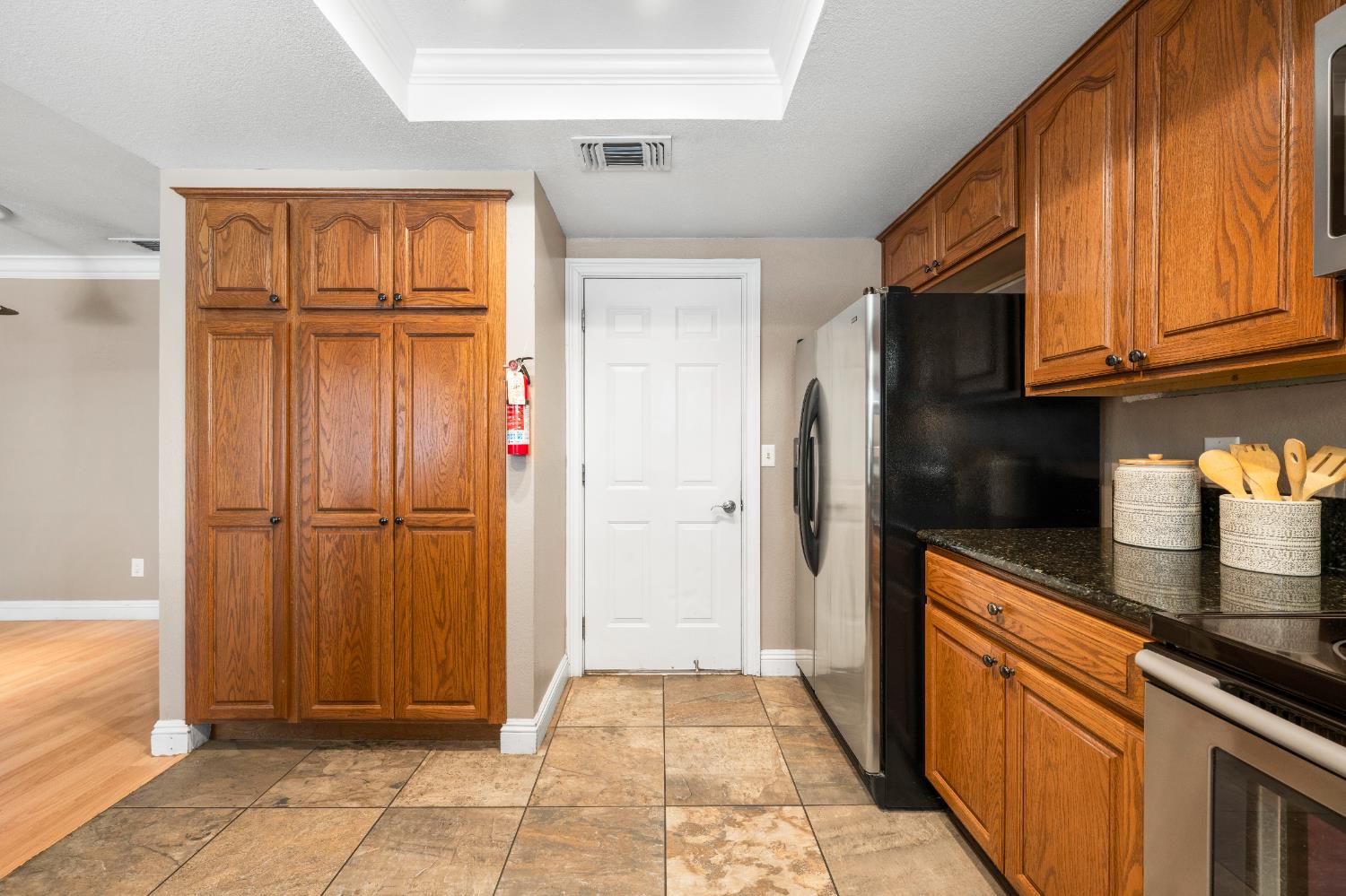 8930 Genoa Avenue Orangevale, CA 95662 - Photo 15 of 46 a kitchen with stainless steel appliances granite countertop a refrigerator and a sink