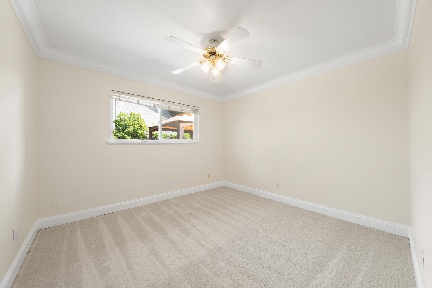 8930 Genoa Avenue Orangevale, CA 95662 - Photo 20 of 46 an empty room with windows and fan