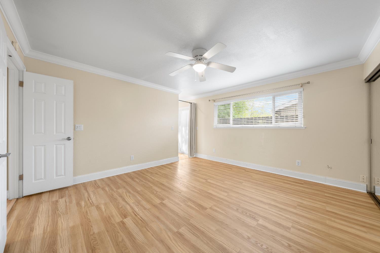 8930 Genoa Avenue Orangevale, CA 95662 - Photo 24 of 46 an empty room with wooden floor and windows