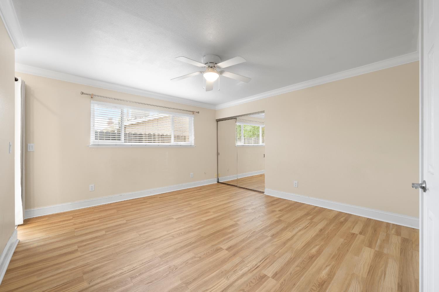 8930 Genoa Avenue Orangevale, CA 95662 - Photo 25 of 46 a view of an empty room with wooden floor and a window