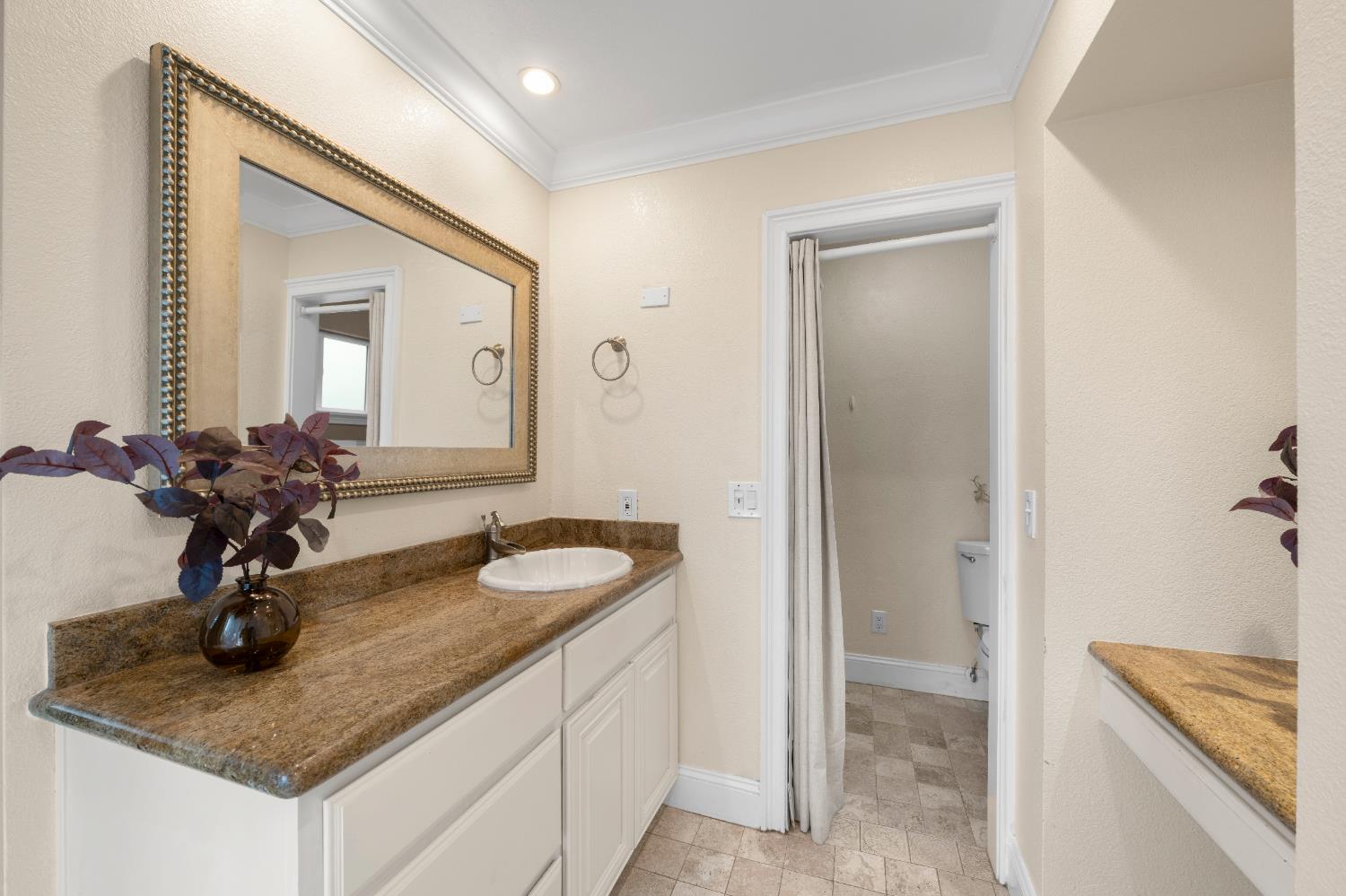 8930 Genoa Avenue Orangevale, CA 95662 - Photo 27 of 46 a bathroom with sink granite and mirror