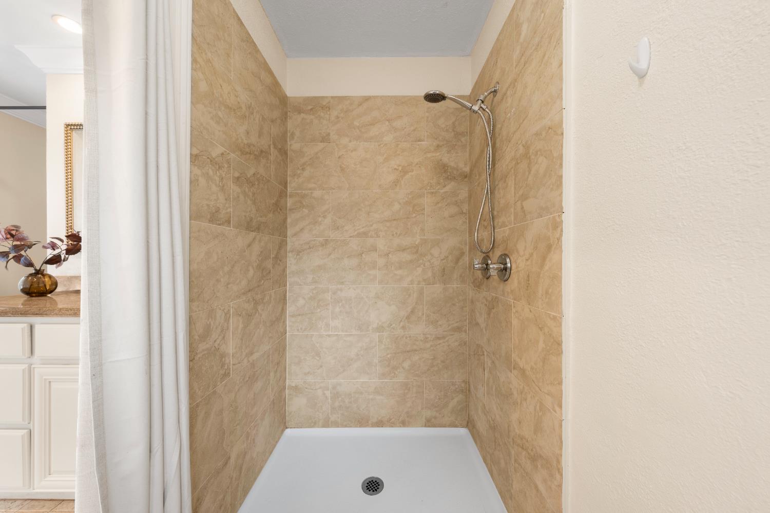 8930 Genoa Avenue Orangevale, CA 95662 - Photo 28 of 46 a bathroom with a tub and shower