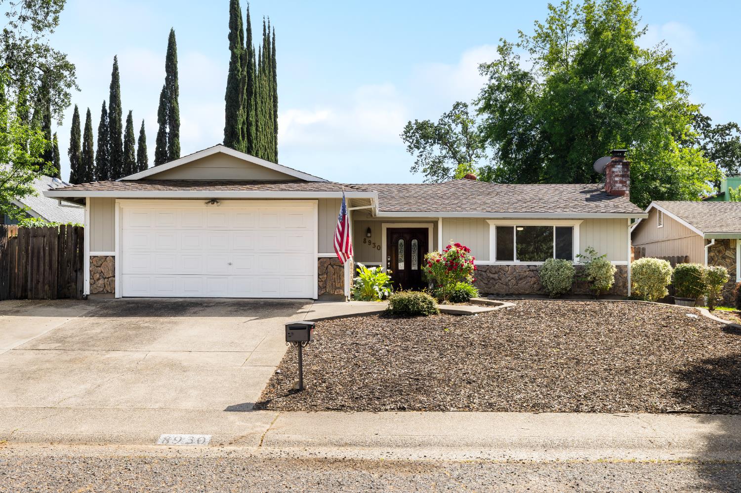 8930 Genoa Avenue Orangevale, CA 95662 - Photo 3 of 46 a front view of a house with a yard and garage
