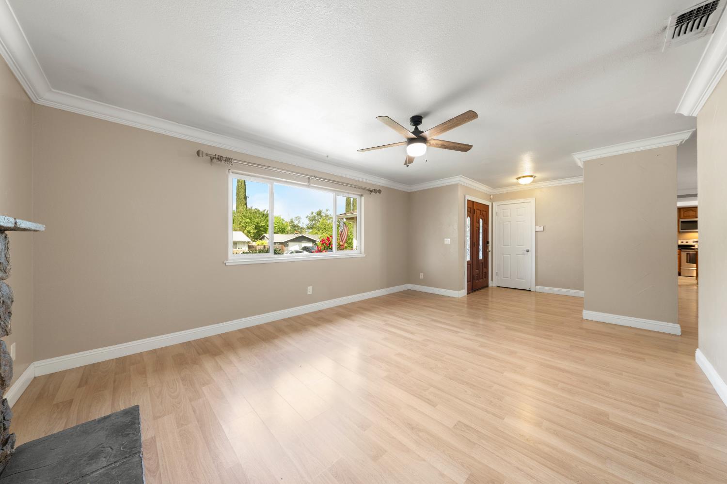 8930 Genoa Avenue Orangevale, CA 95662 - Photo 6 of 46 an empty room with windows and ceiling fan
