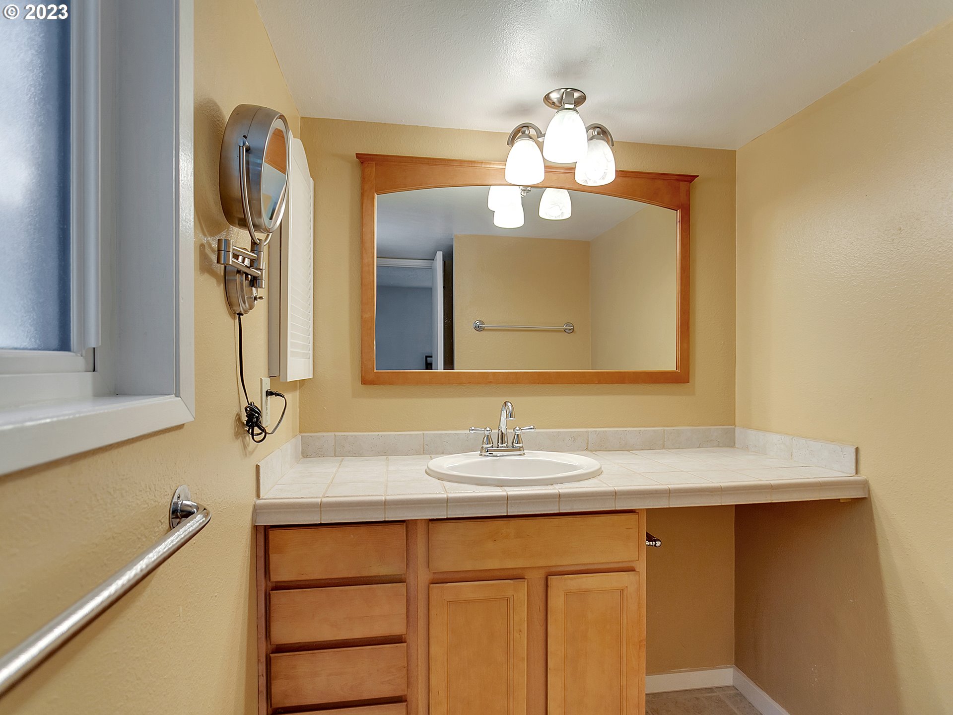 5715 Southwest Pendleton Street Portland, OR 97221 - Photo 16 of 31 a bathroom with a sink and a mirror