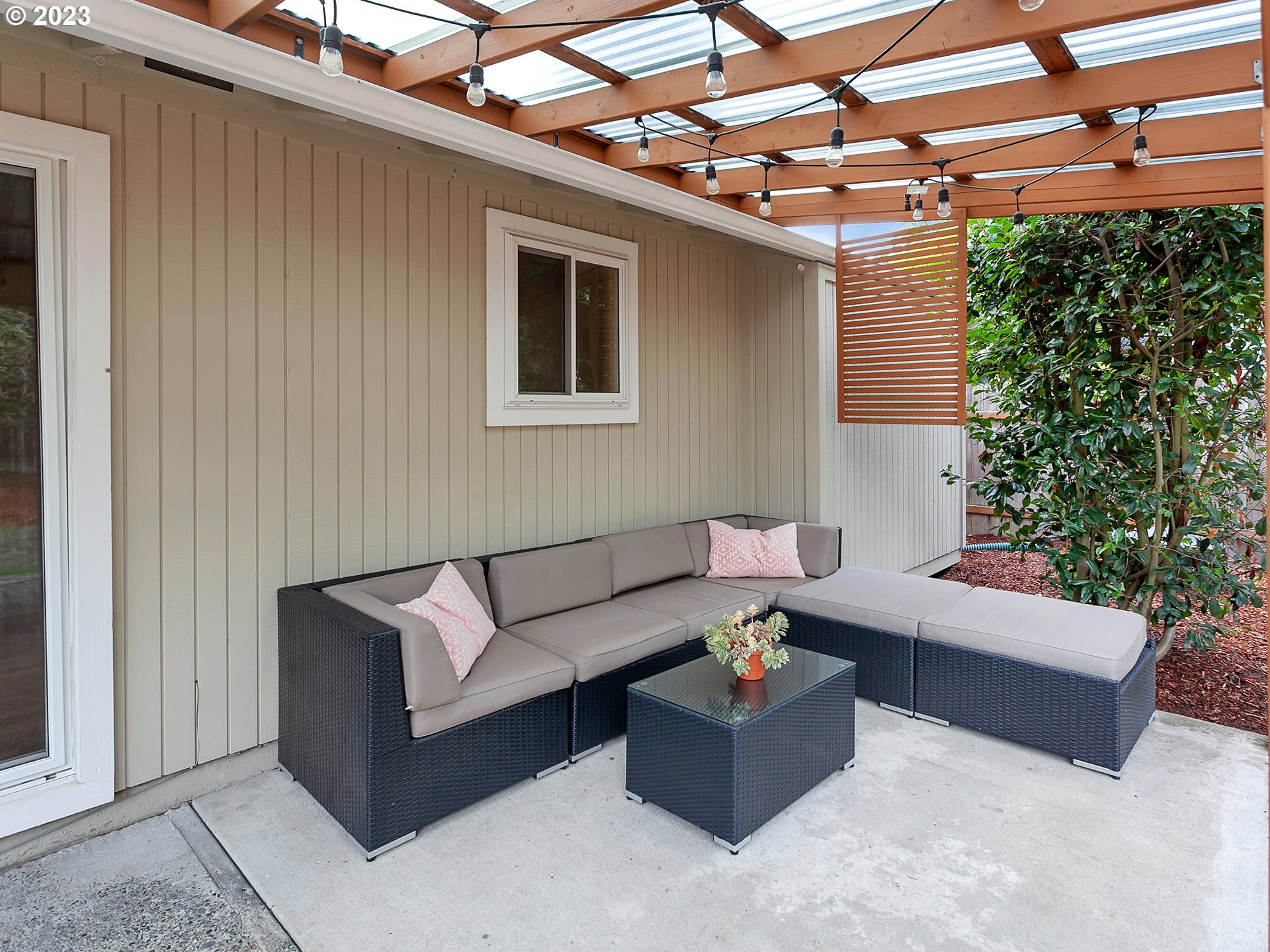 5715 Southwest Pendleton Street Portland, OR 97221 - Photo 20 of 31 a living room with furniture and a potted plant