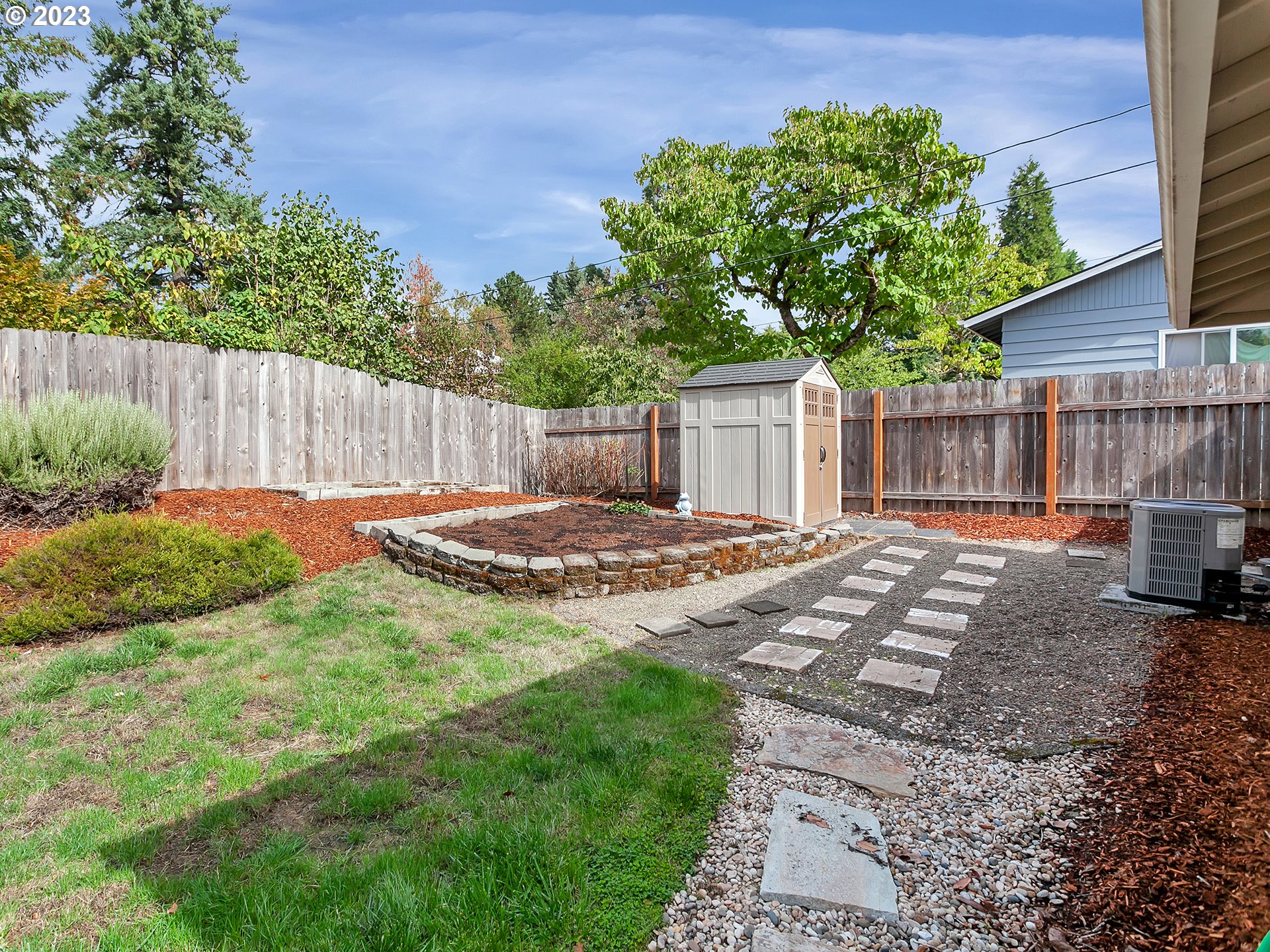 5715 Southwest Pendleton Street Portland, OR 97221 - Photo 21 of 31 a backyard of a house with lots of green space