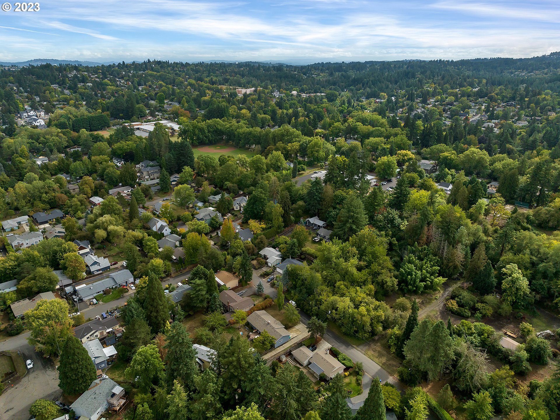 5715 Southwest Pendleton Street Portland, OR 97221 - Photo 23 of 31 an aerial view of residential houses with outdoor space and trees