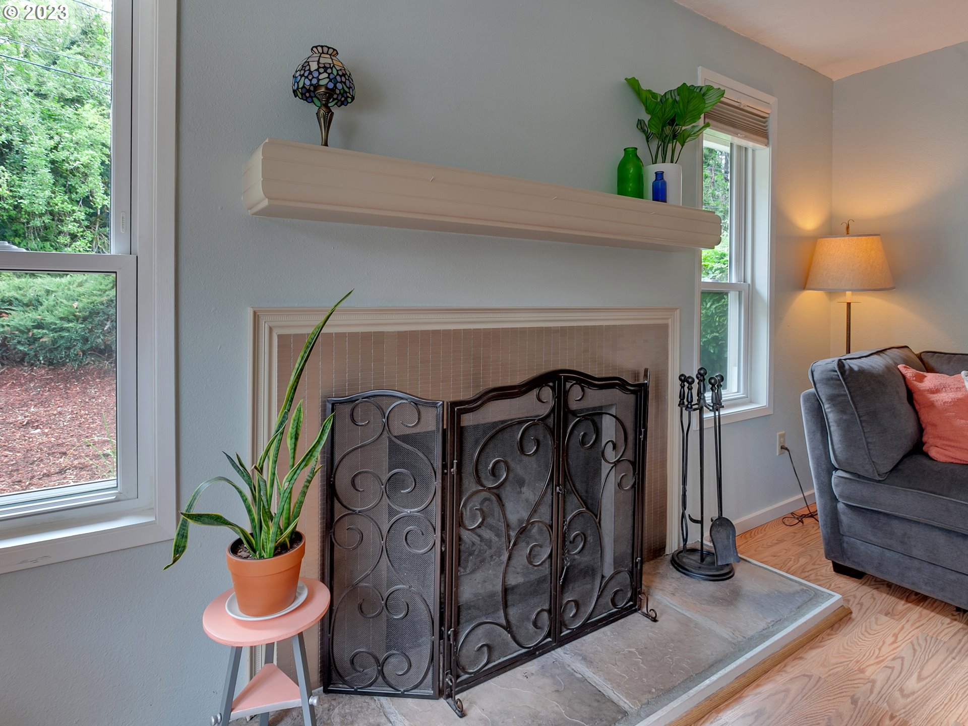 5715 Southwest Pendleton Street Portland, OR 97221 - Photo 4 of 31 a front view of a house with garden and furniture