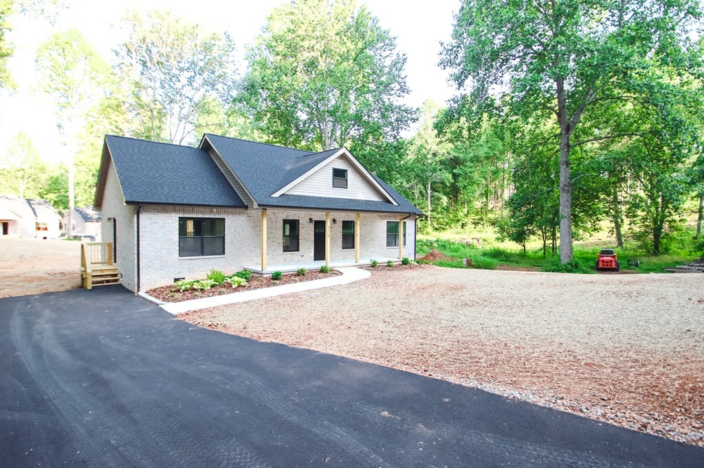 329 Webb Drive Sparta, TN 38583 - Photo 2 of 17 a front view of house with yard and green space