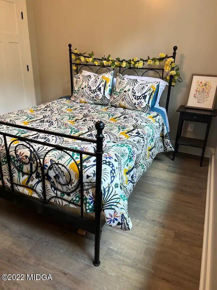 142 Towaliga Road Forsyth, GA 31029 - Photo 13 of 21 a bed sitting in a bedroom next to a lamp