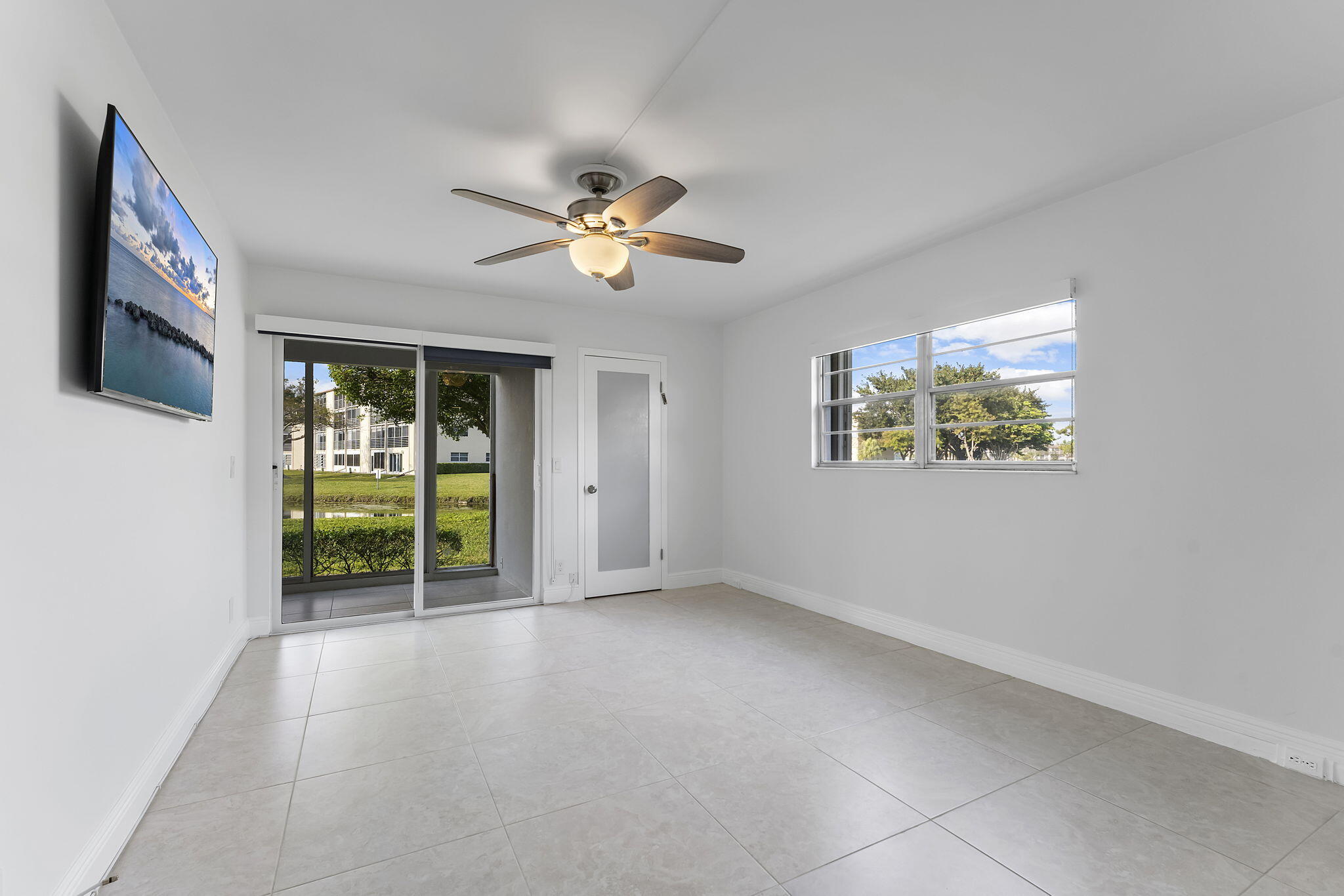 1037 Guilford C Boca Raton, FL 33434 - Photo 15 of 35 a view of an empty room with a window
