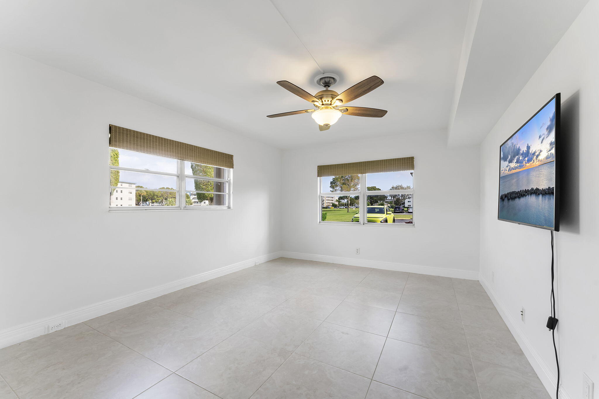 1037 Guilford C Boca Raton, FL 33434 - Photo 19 of 35 a view of an empty room with a window