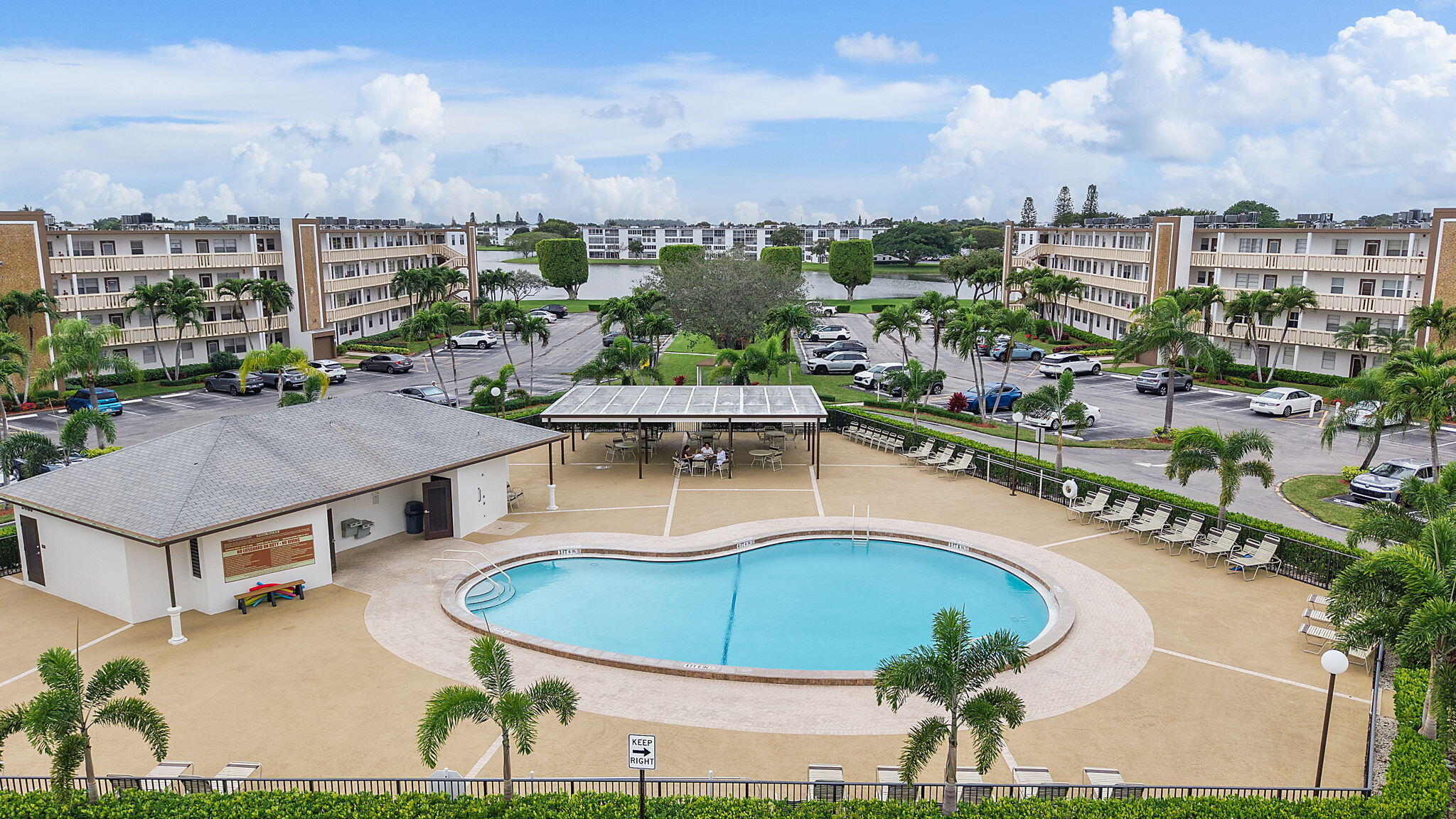 1037 Guilford C Boca Raton, FL 33434 - Photo 31 of 35 a view of a swimming pool and lake view