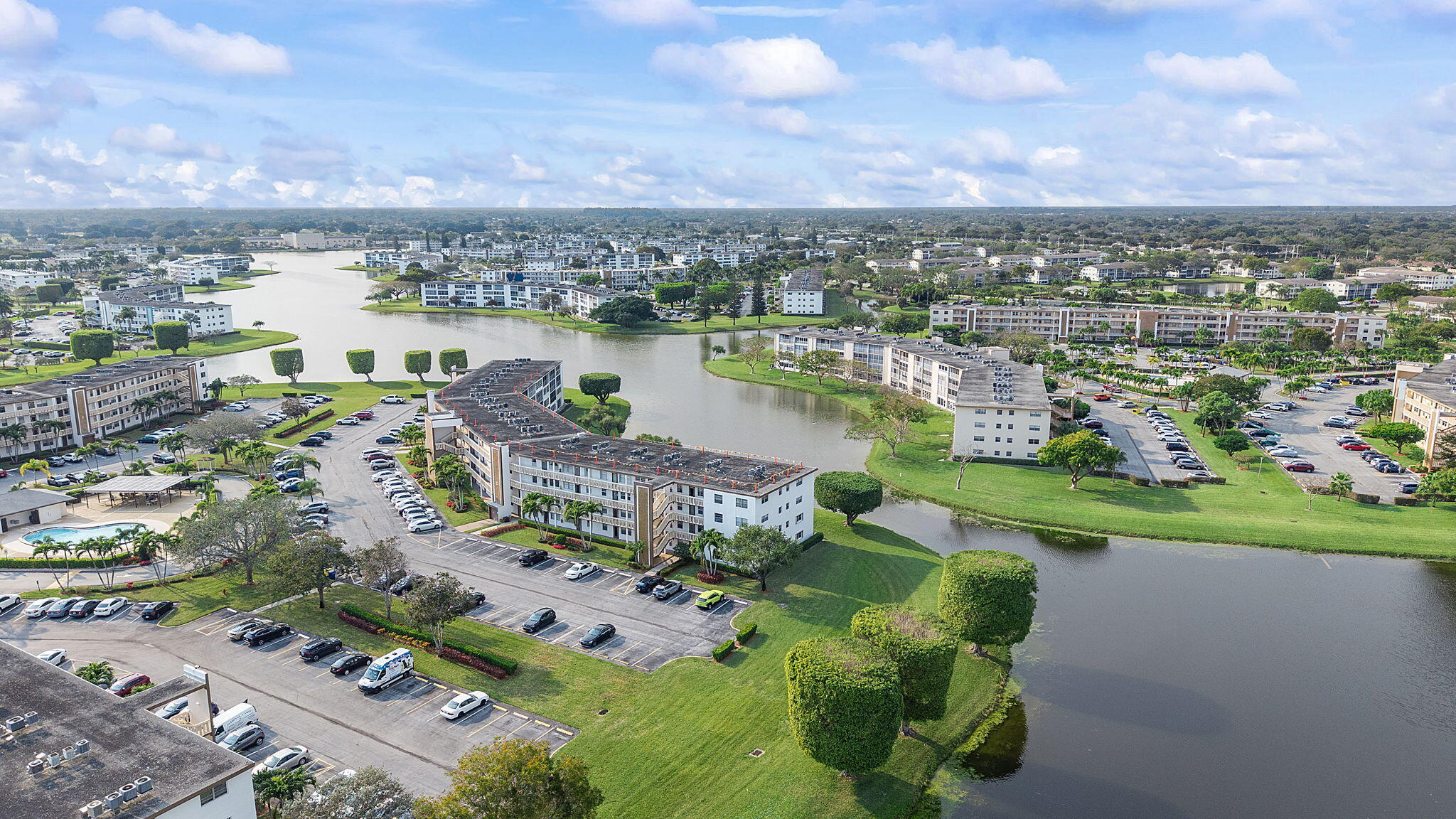 1037 Guilford C Boca Raton, FL 33434 - Photo 32 of 35 a view of a lake with a city