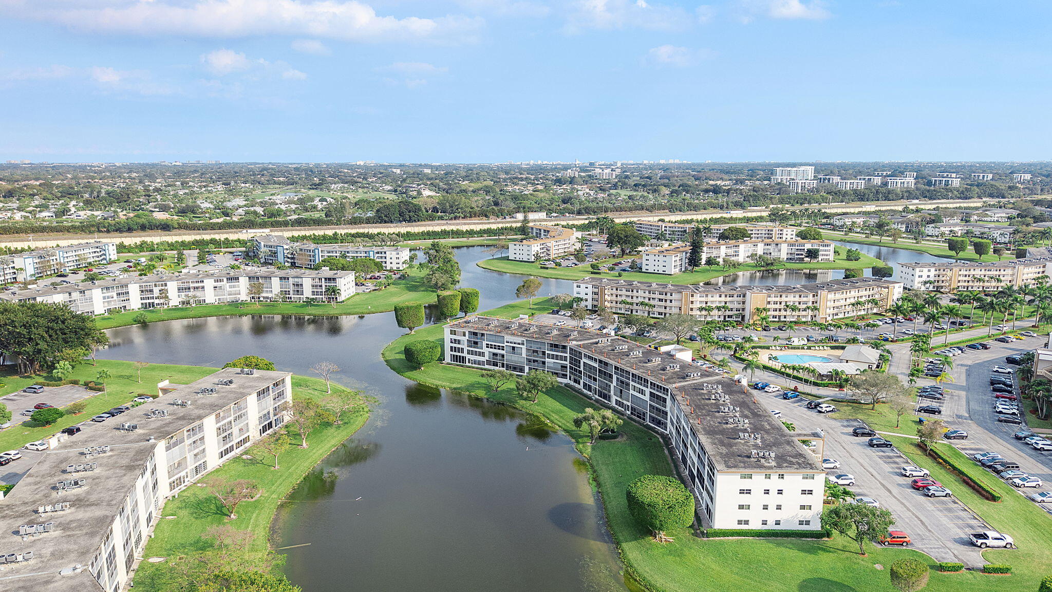 1037 Guilford C Boca Raton, FL 33434 - Photo 35 of 35 a view of a lake with a city