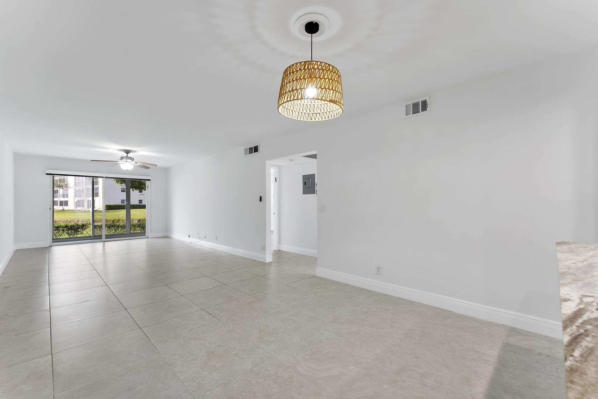 1037 Guilford C Boca Raton, FL 33434 - Photo 10 of 35 a view of an empty room with a window