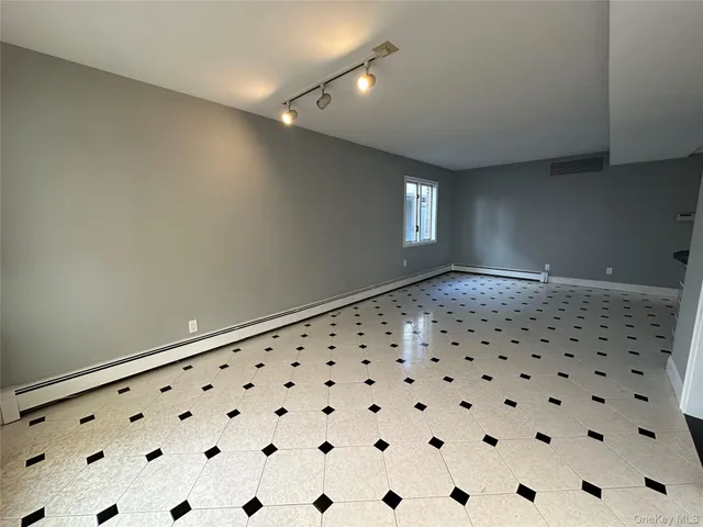 a view of a hallway with windows