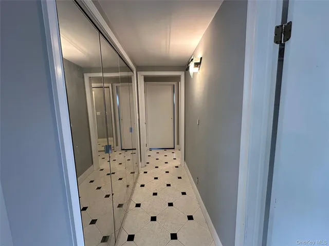 a bathroom with a shower and a sink