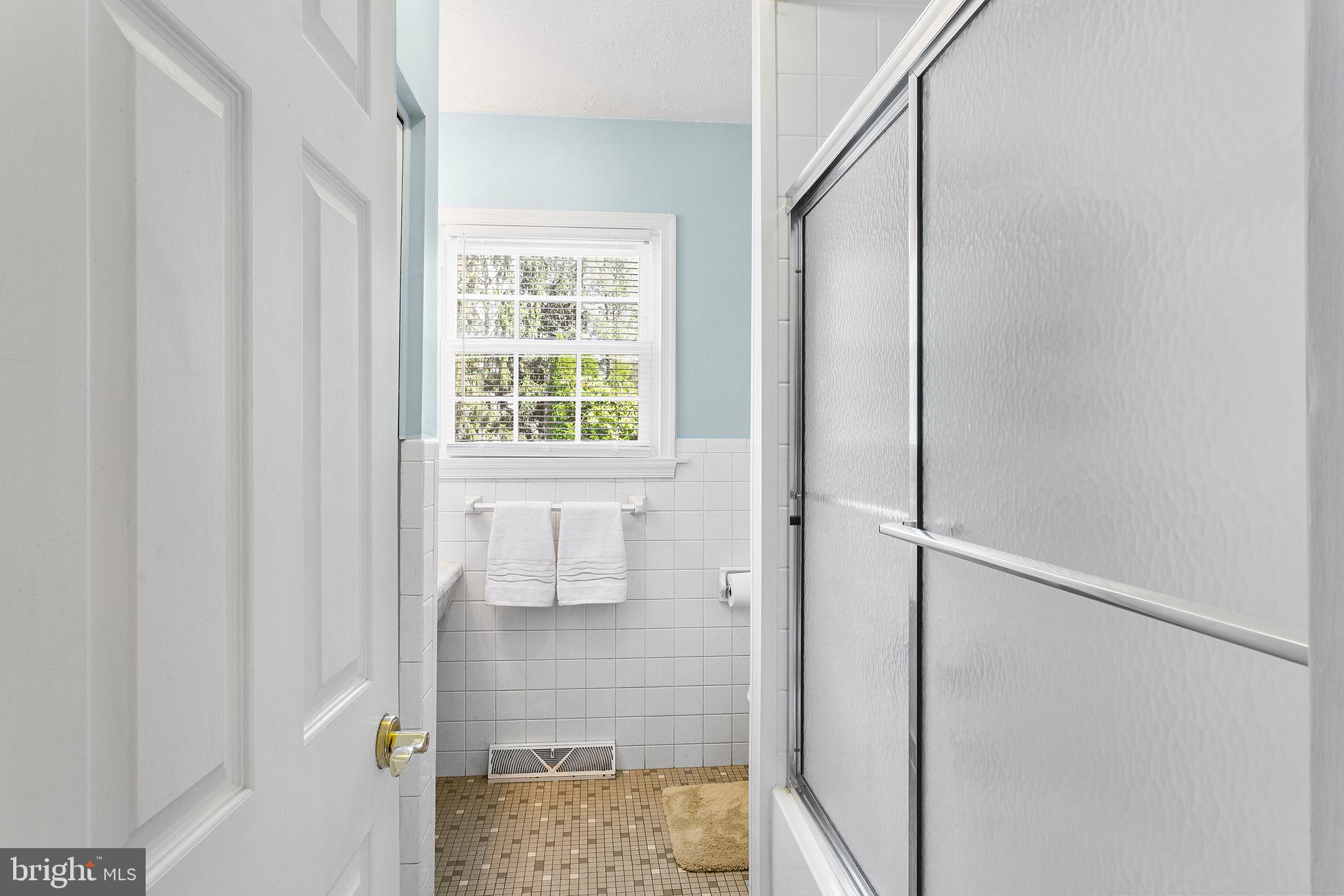 409 Franklin Road Glassboro, NJ 08028 - Photo 12 of 30 a bathroom with a glass shower door