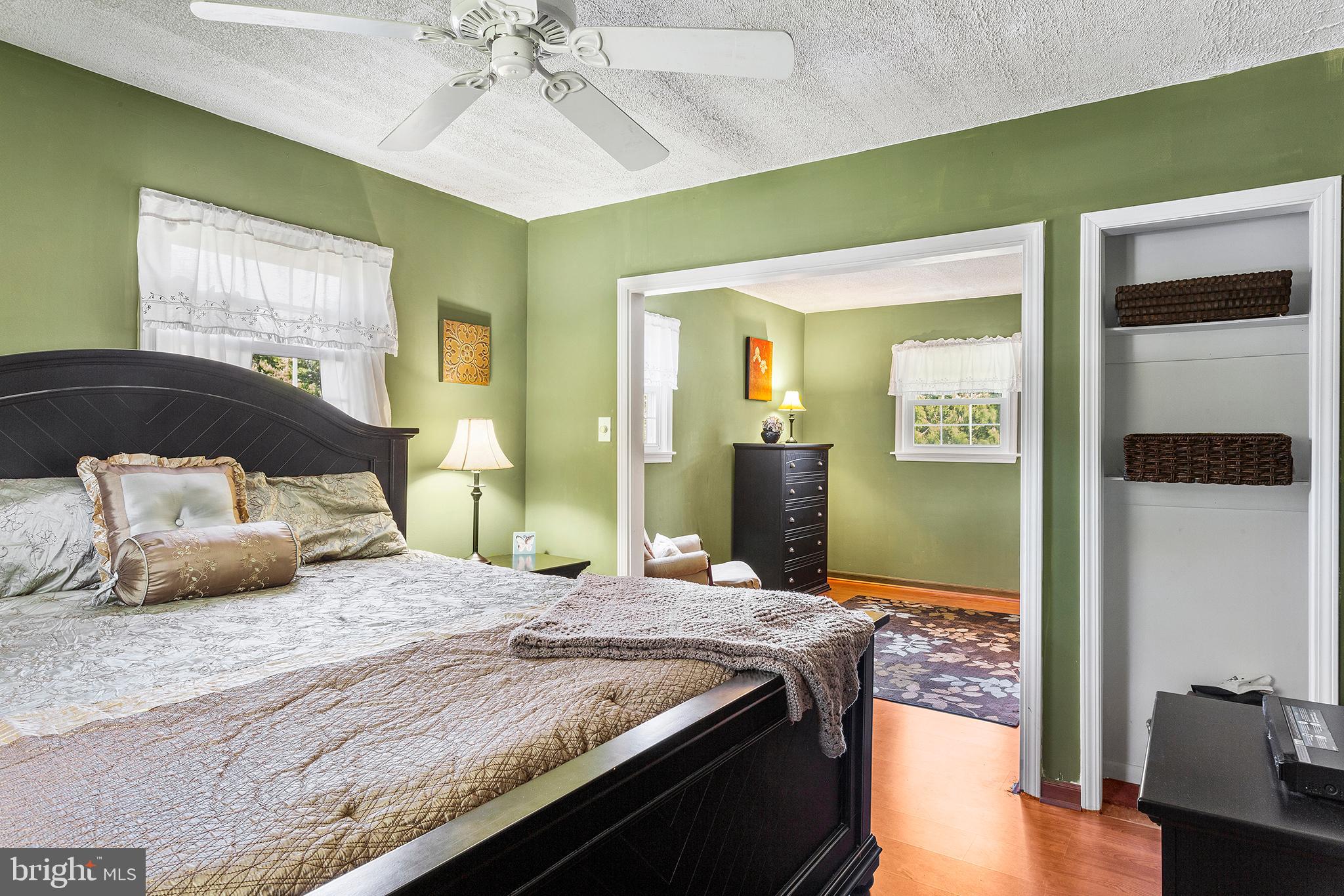 409 Franklin Road Glassboro, NJ 08028 - Photo 14 of 30 a bedroom with a large bed and a chandelier