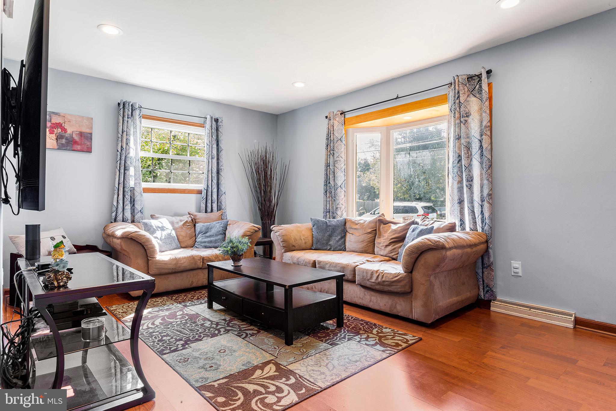 409 Franklin Road Glassboro, NJ 08028 - Photo 5 of 30 a living room with furniture and a large window