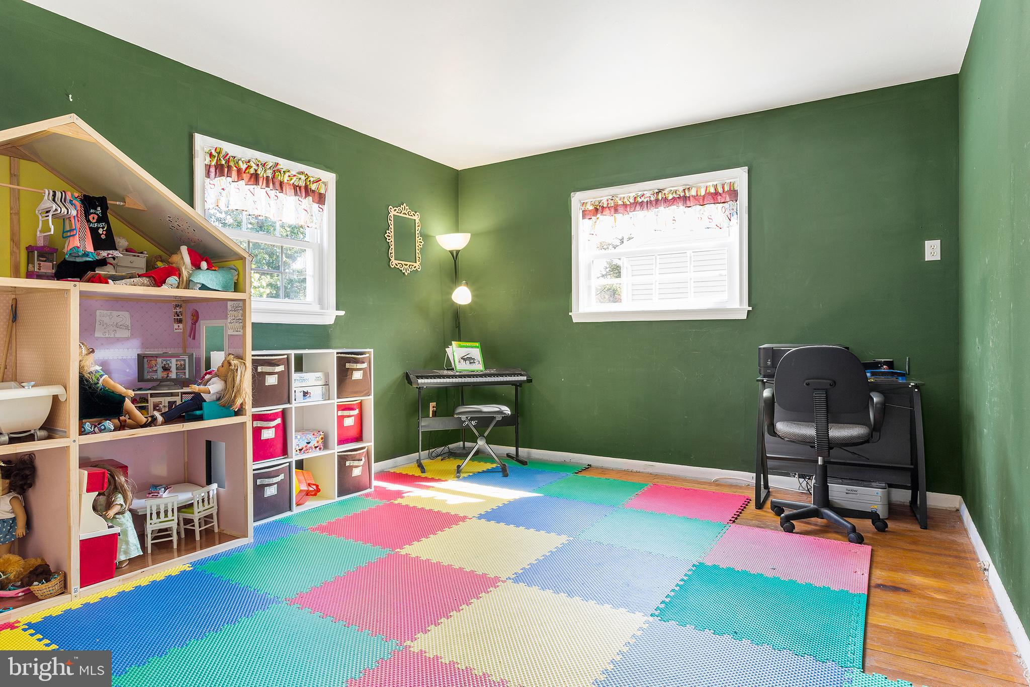 409 Franklin Road Glassboro, NJ 08028 - Photo 10 of 30 a room with musical instruments and a wooden floor
