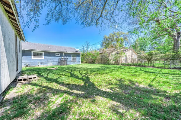 a view of house with backyard