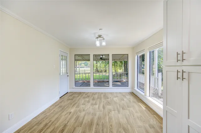a view of room with window and ceiling fan