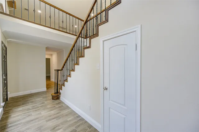 a bathroom with a granite countertop sink a toilet and a mirror