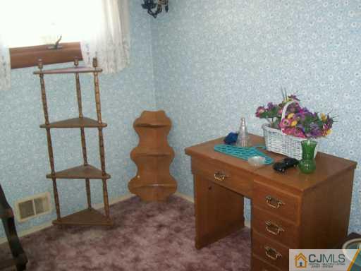 7 Lehigh Road Old Bridge, NJ 08859 - Photo 7 of 8 a kitchen with a refrigerator and a table