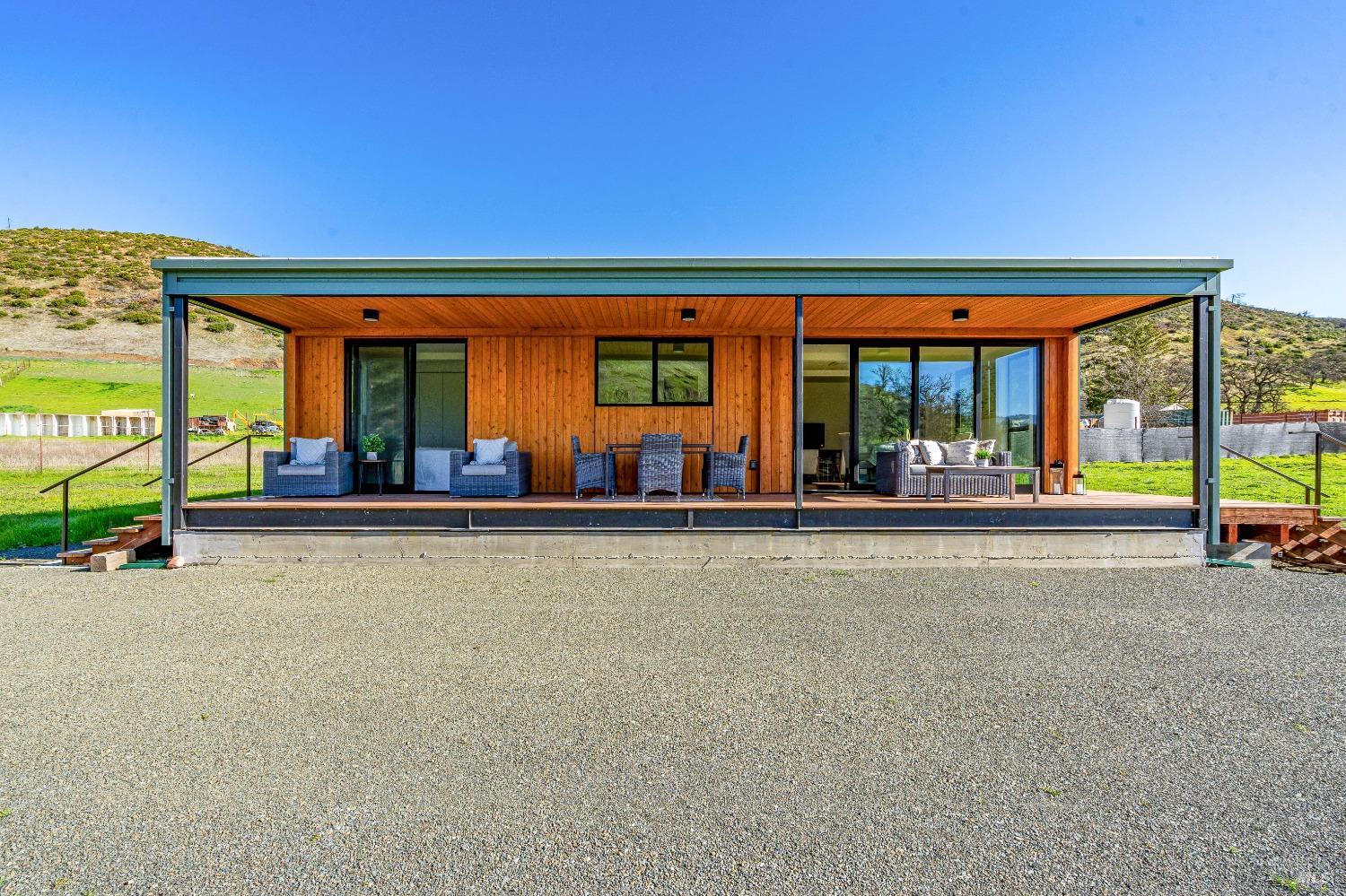 an empty room with sliding door and wooden floor