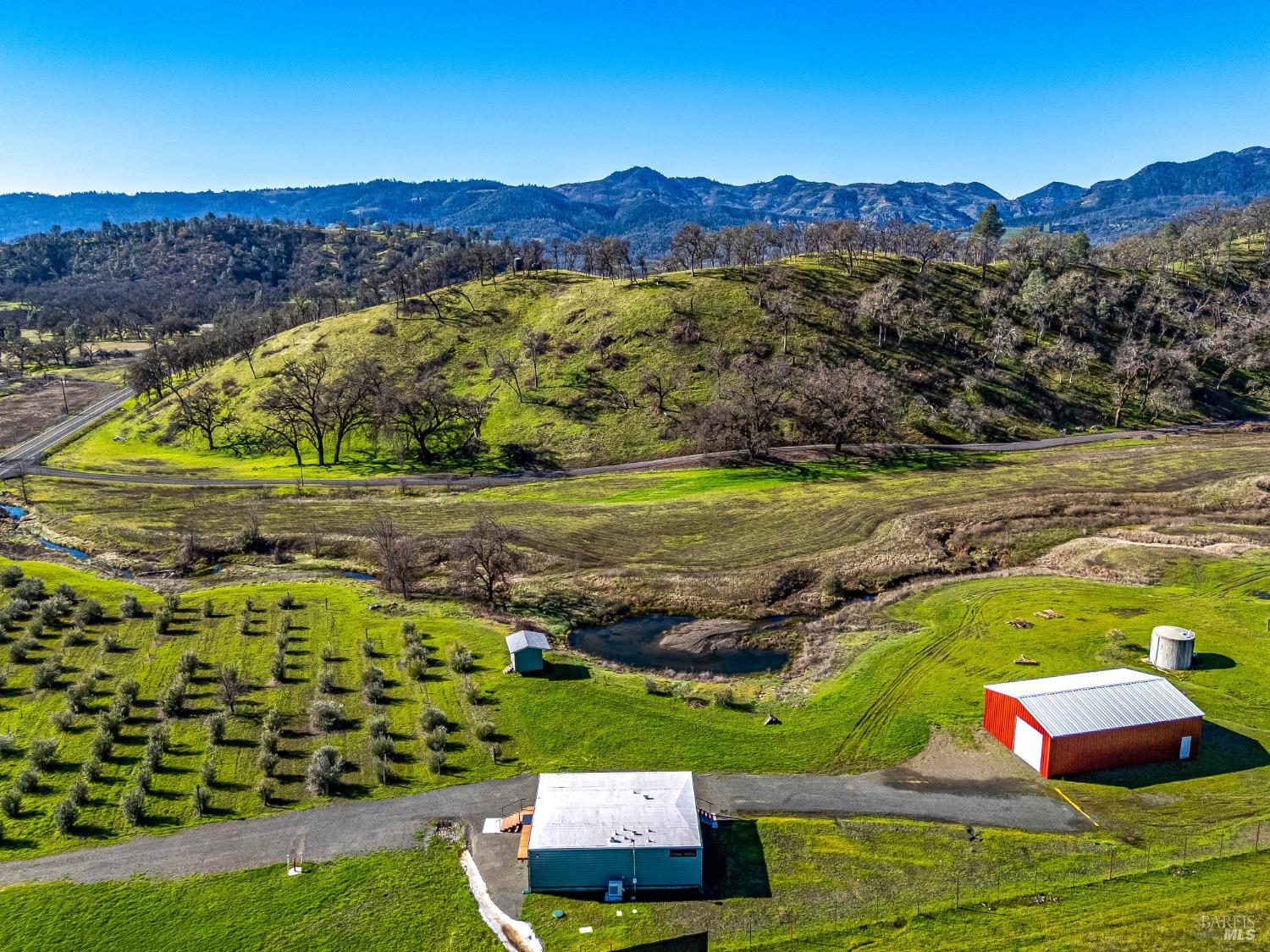 7871 Butts Canyon Road Pope Valley, CA 94567 - Photo 26 of 31 a view of a city with mountains in the background