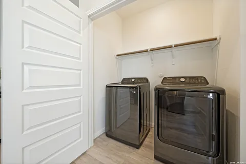 a utility room with washer and dryer