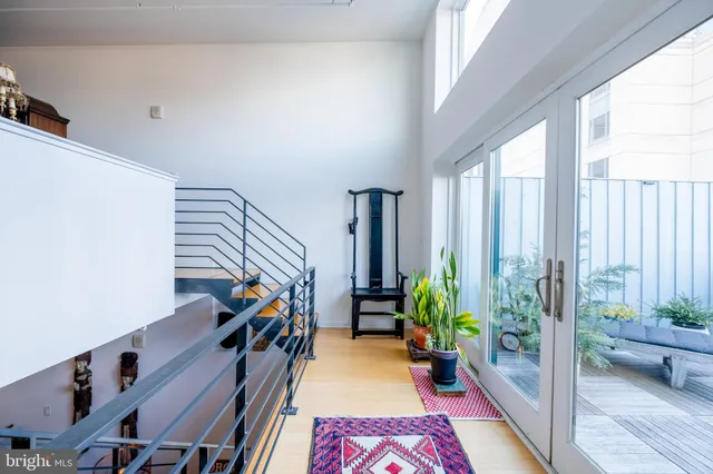 a view of an entryway with wooden floor
